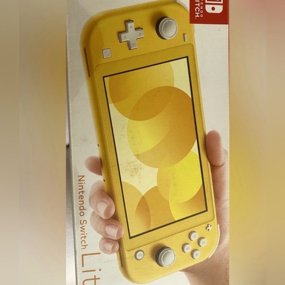 Nintendo Switch Lite Brand new in box with original aadapter. Used 2 times